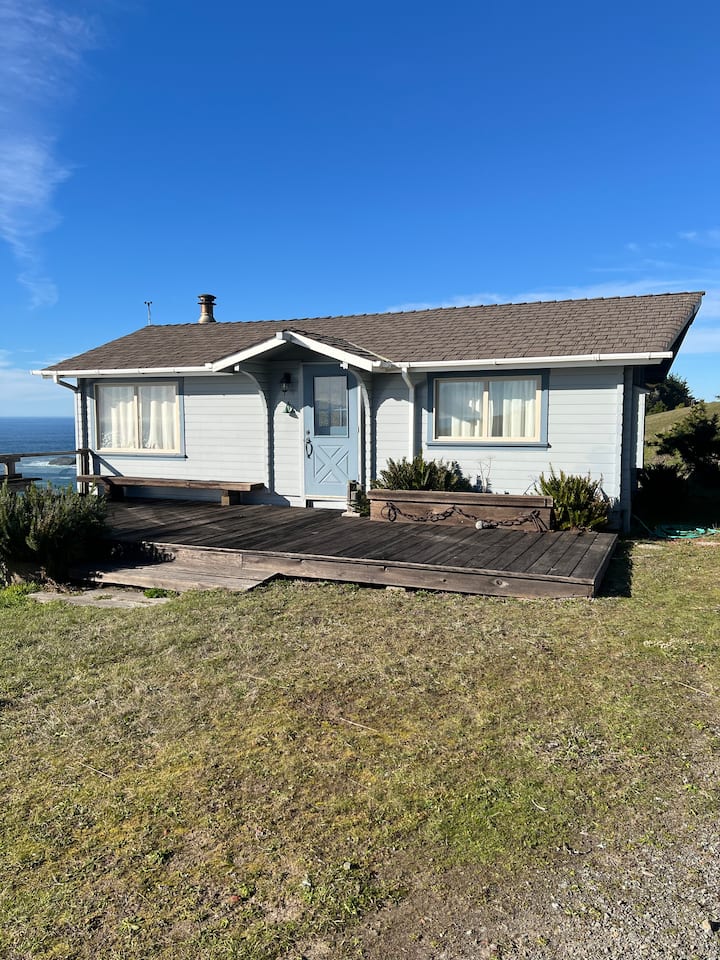 Ocean View Cabin perched above the cliff.