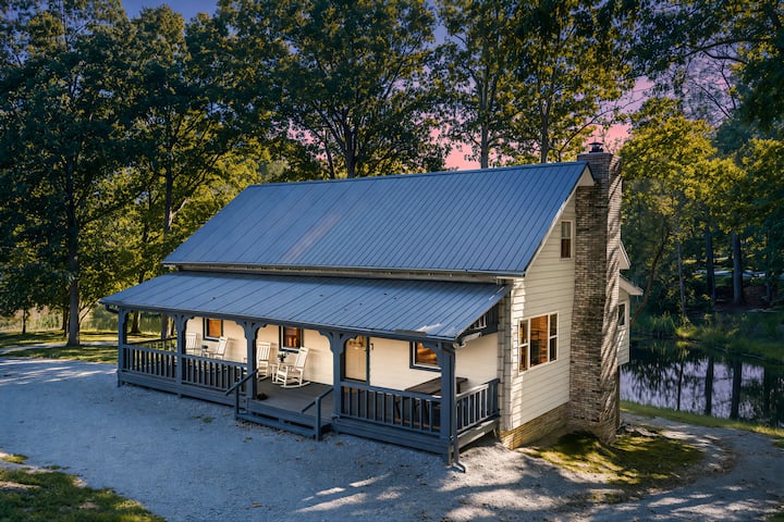 Peaceful pondside stay with cozy spaces + porches